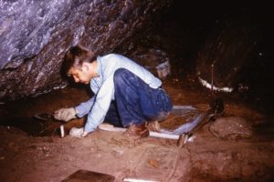 Excavator sitting on screen in rock shelter